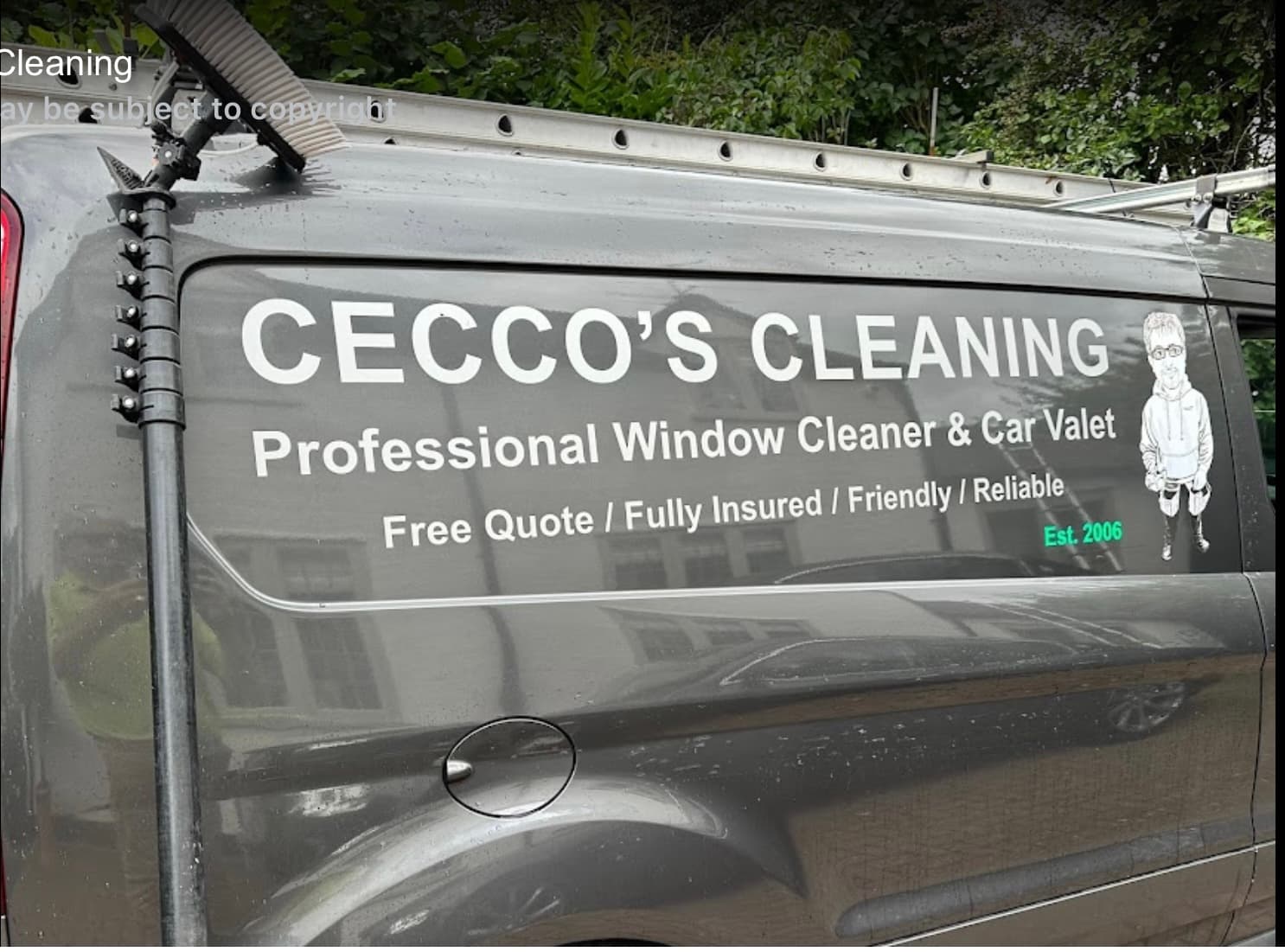 A person cleaning a window A person cleaning a window